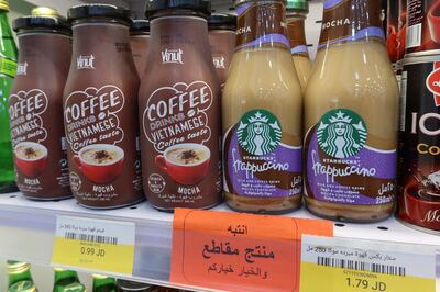 A sign reading: 'Warning: This product is boycotted.  The choice is yours. ' is seen at a supermaket in Amman. Reuters
