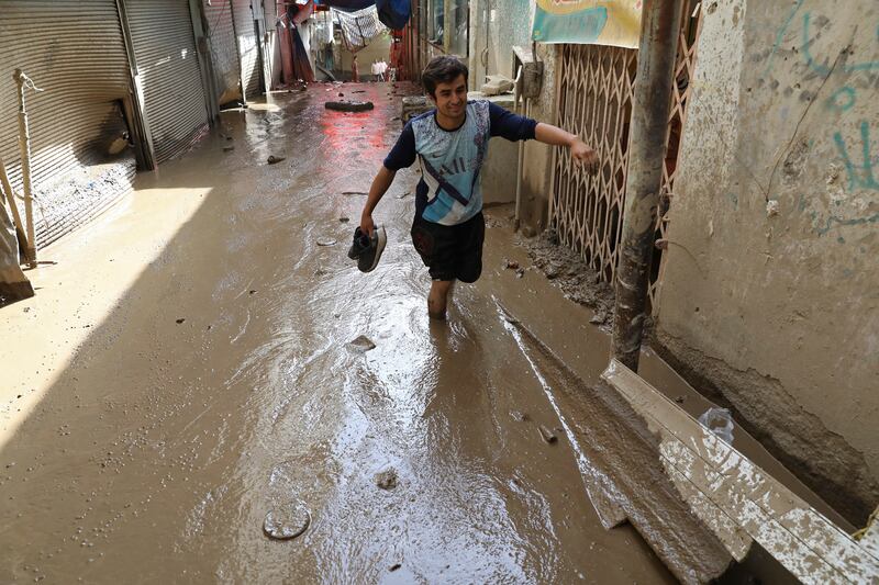 A muddy lane in Emamzadeh Davoud. AP Photo