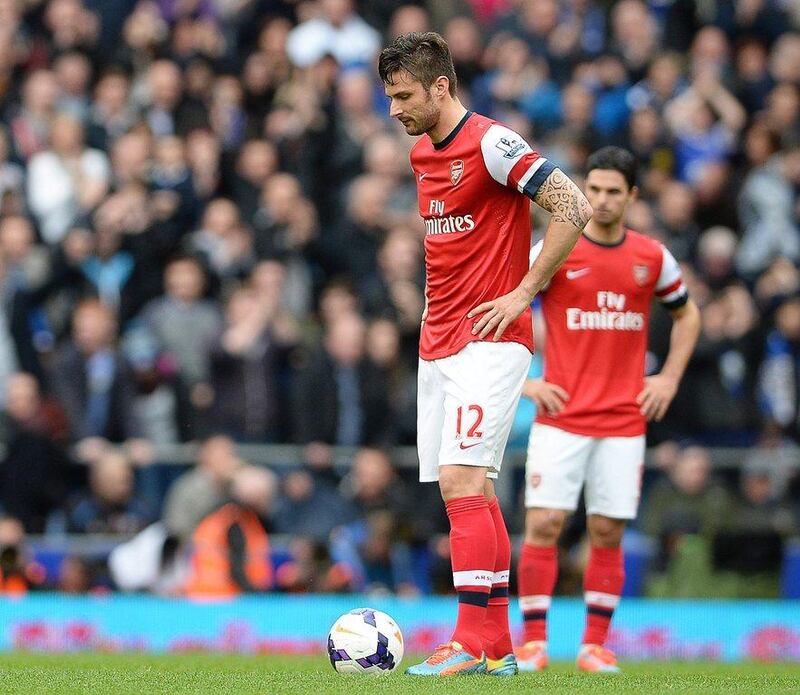 Arsenal players Olivier Giroud and Mikel Arteta show their dejection during their Premier League loss to Everton on Sunday. Peter Powell / EPA / April 6, 2014