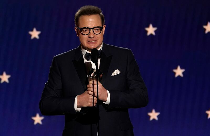 Brendan Fraser accepts the Best Actor award for his role in The Whale. AP