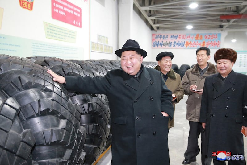 In this undated photo provided on Sunday, Dec. 3, 2017, by the North Korean government, North Korean leader Kim Jong Un inspects a local tire factory in Chagang Province, North Korea. Kim thanked workers at a factory that built the tires for a huge vehicle used to transport a new intercontinental ballistic missile that was test-launched this week. Independent journalists were not given access to cover the event depicted in this image distributed by the North Korean government. The content of this image is as provided and cannot be independently verified. Korean language watermark on image as provided by source reads: "KCNA" which is the abbreviation for Korean Central News Agency. (Korean Central News Agency/Korea News Service via AP)