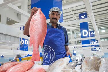 DUBAI, UNITED ARAB EMIRATES - Mohammed Nasir a vendor inside the seafood section at the Waterfront Market, Deira. Leslie Pableo for The National