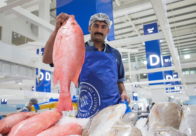 DUBAI, UNITED ARAB EMIRATES - Mohammed Nasir a vendor inside the seafood section at the Waterfront Market, Deira.  Leslie Pableo for The National