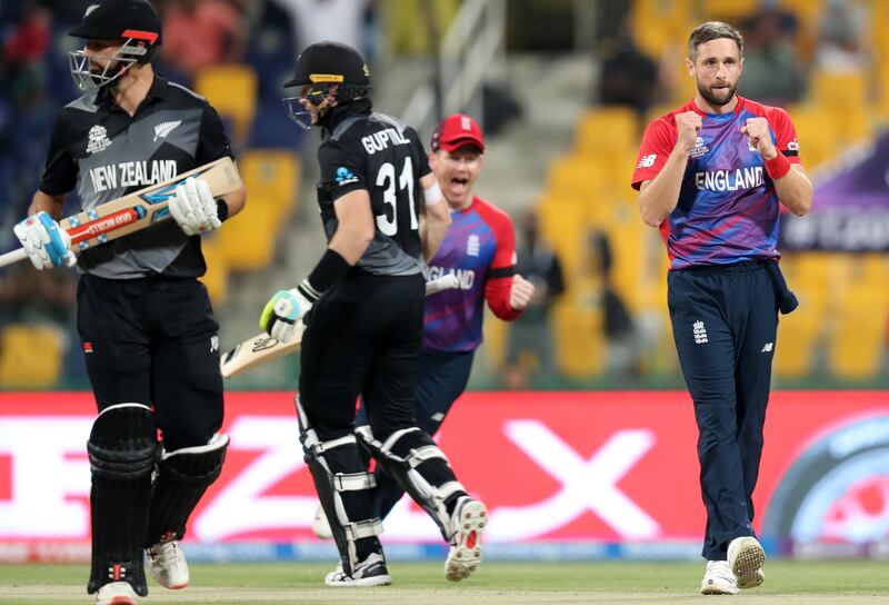 England's Chris Woakes takes the wicket of New Zealand's Martin Guptill at the Zayed Cricket Stadium in Abu Dhabi