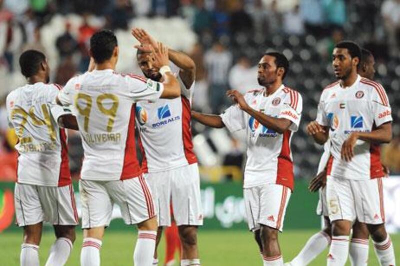 Ricardo Oliveira, second from left, scored Al Jazira's first goal against Emirates on Saturday night.