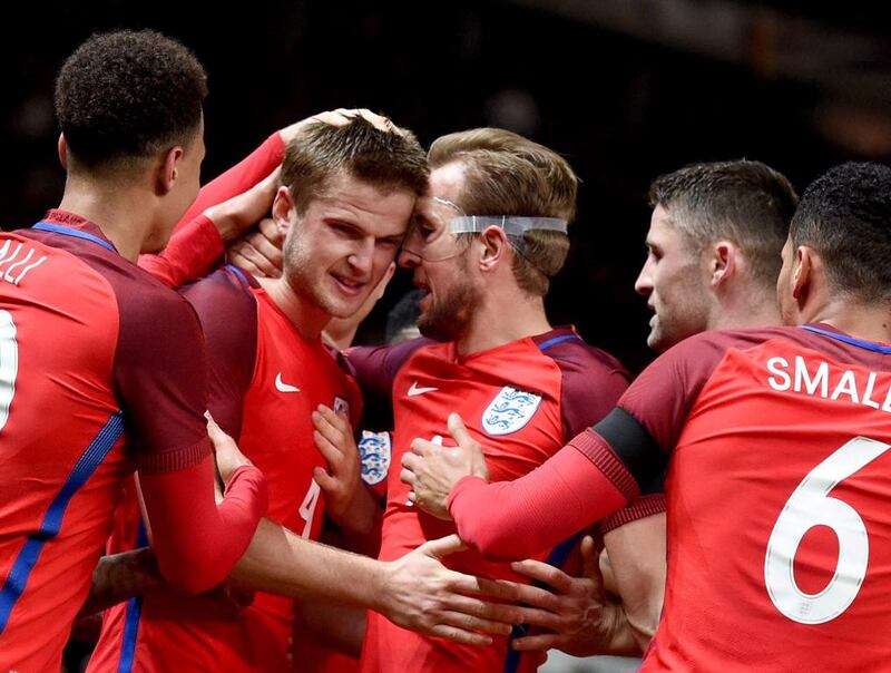 Eric Dier (2nd L) of England celebrates with teammates after scoring the winning goal during the international friendly soccer match between Germany and England in Berlin, Germany, 26 March 2016.  EPA/ANNEGRET HILSE