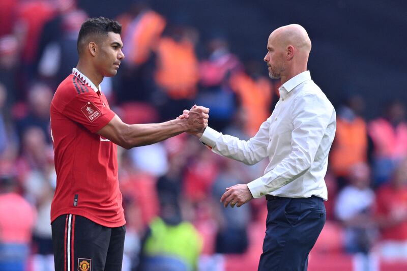 Manchester United manager Erik ten Hag consoles Casemiro after the defeat to Manchester City in the FA Cup final at Wembley on Saturday, June 3, 2023. AFP