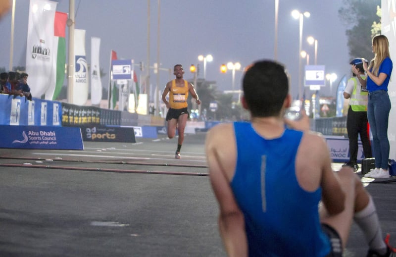 ABU DHABI, UNITED ARAB EMIRATES- Finisher at the ADNOC ABU Abu Dhabi Marathon.  Leslie Pableo for The National 
