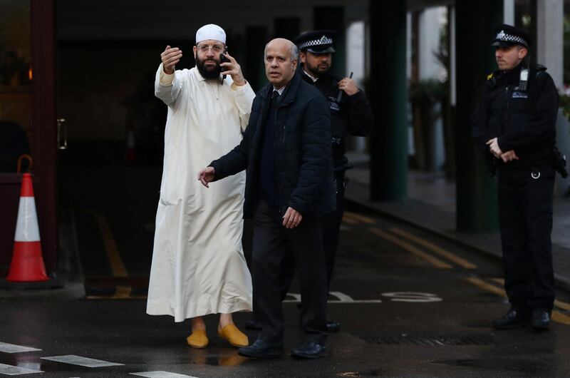 A man gestures as police officers are seen outside the London Central Mosque. Reuters