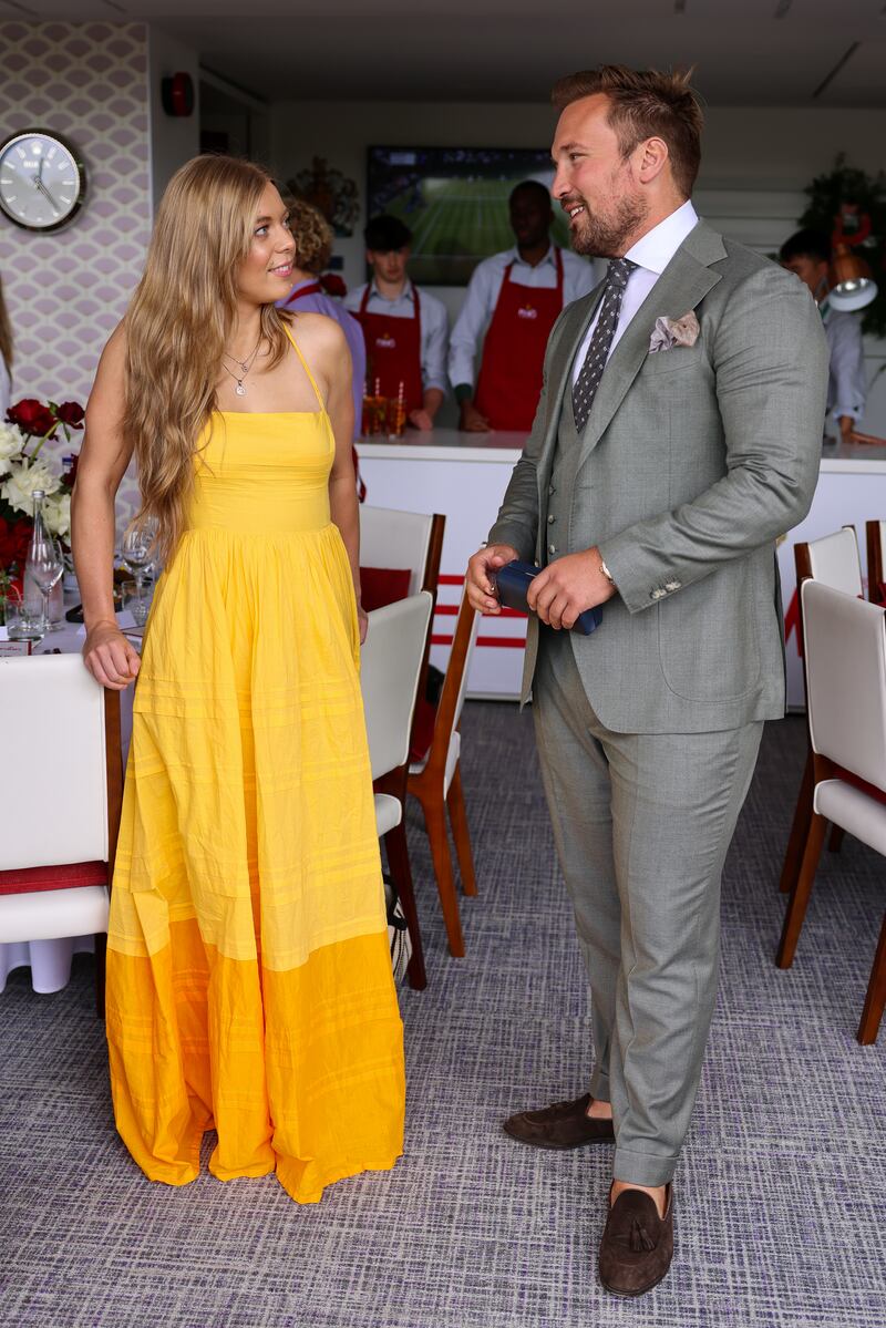 British singer Becky Hill, left, and former rugby player Paul Doran-Jones attend Pimm's No 1 hospitality suite. Getty Images for Pimm's