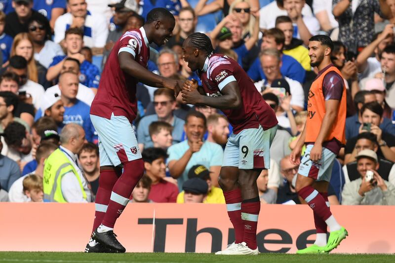 West Ham's Michail Antonio celebrates with Kurt Zouma after scoring the first goal against Chelsea. Getty