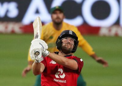 FILE PHOTO: Cricket - Third International Twenty20 - South Africa v England - Newlands Cricket Ground, Cape Town, South Africa - December 1, 2020  England's Dawid Malan hits a six REUTERS/Sumaya Hisham/File Photo