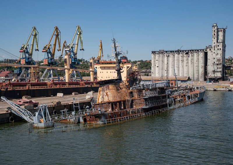 A damaged Ukrainian navy ship, the 'Donbas', lies partially submerged near the pier in the port city of Mariupol. EPA