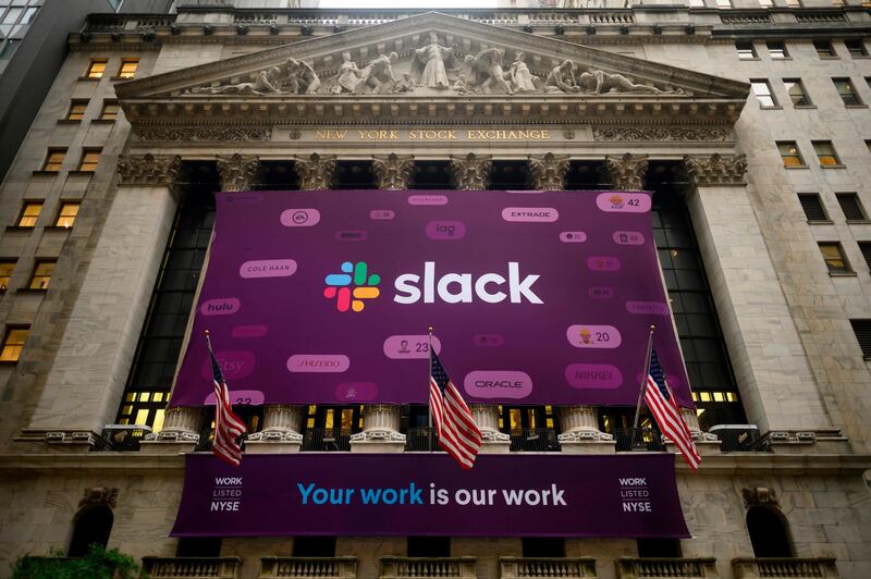 The logo of the Slack Technologies Inc. is seen outside the New York Stock Exchange (NYSE) after their company  public offering (IPO) on June 20, 2019 located at Wall Street in New York City. Software company Slack Technologies climbed on the New York Stock Exchange Thursday after debuting in a direct listing, in the latest sign of Wall Street's appetite for new technology entrants.Shares of the company, whose arrival was marked with a giant purple banner outside the NYSE, initially surged as high as $42 before pulling back somewhat and finishing at $38.62. The exchange had set a reference price of $26.
 / AFP / Johannes EISELE

