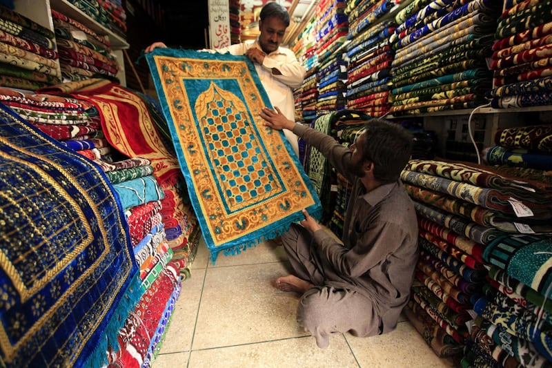 People buy prayer mats ahead of Ramadan, in Peshawar, Pakistan.  EPA