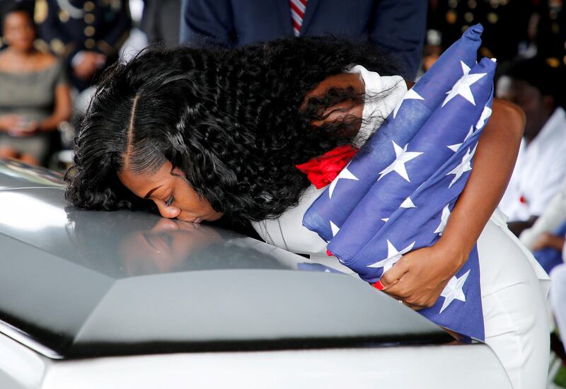Myeshia Johnson, wife of U.S. Army Sergeant La David Johnson, who was among four special forces soldiers killed in Niger, kisses his coffin at a graveside service in Hollywood, Florida. Joe Skipper / Reuters