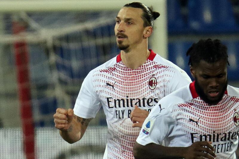 Zlatan Ibrahimovic (L) celebrates after scoring AC Milan's first goal. EPA
