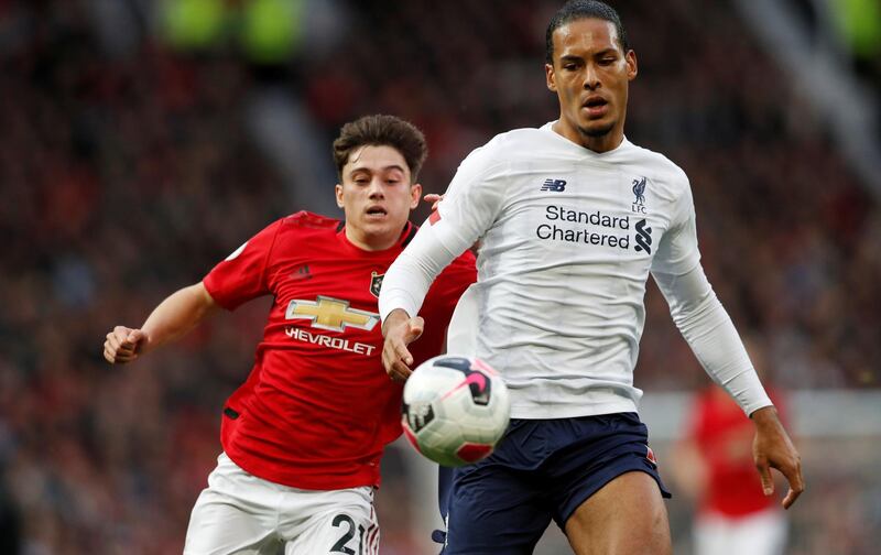 Liverpool's Virgil van Dijk in action with Manchester United's Daniel James. Reuters