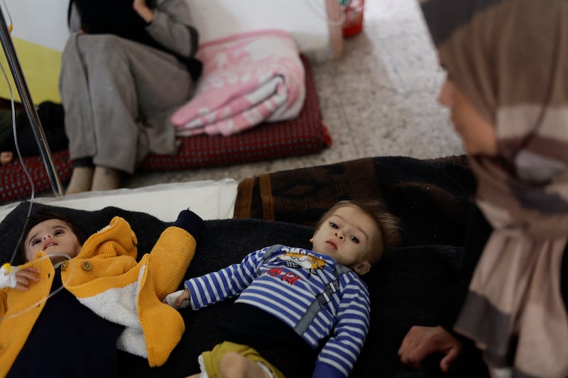 A Palestinian boy who is suffering from malnutrition is treated at a healthcare centre amid widespread hunger. Reuters