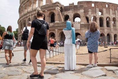 The revival in tourism was partly credited to good weather, with visitors seen here at the Colosseum in Rome. Getty 