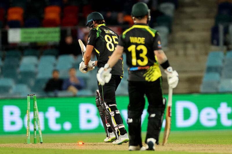 Australia's Tim David is clean bowled by England's Sam Curran. AFP