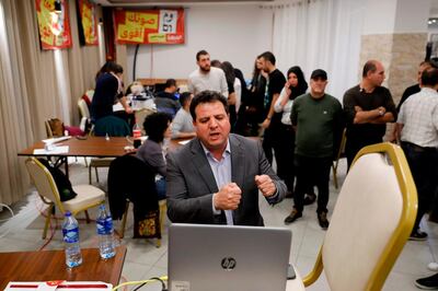 Israeli Arab politician Ayman Odeh (C) of the Hadash party speaks during a Facebook live video event at the party's headquarters in Nazareth in northern Israel on election tonight on April 9, 2019. / AFP / Ahmad GHARABLI
