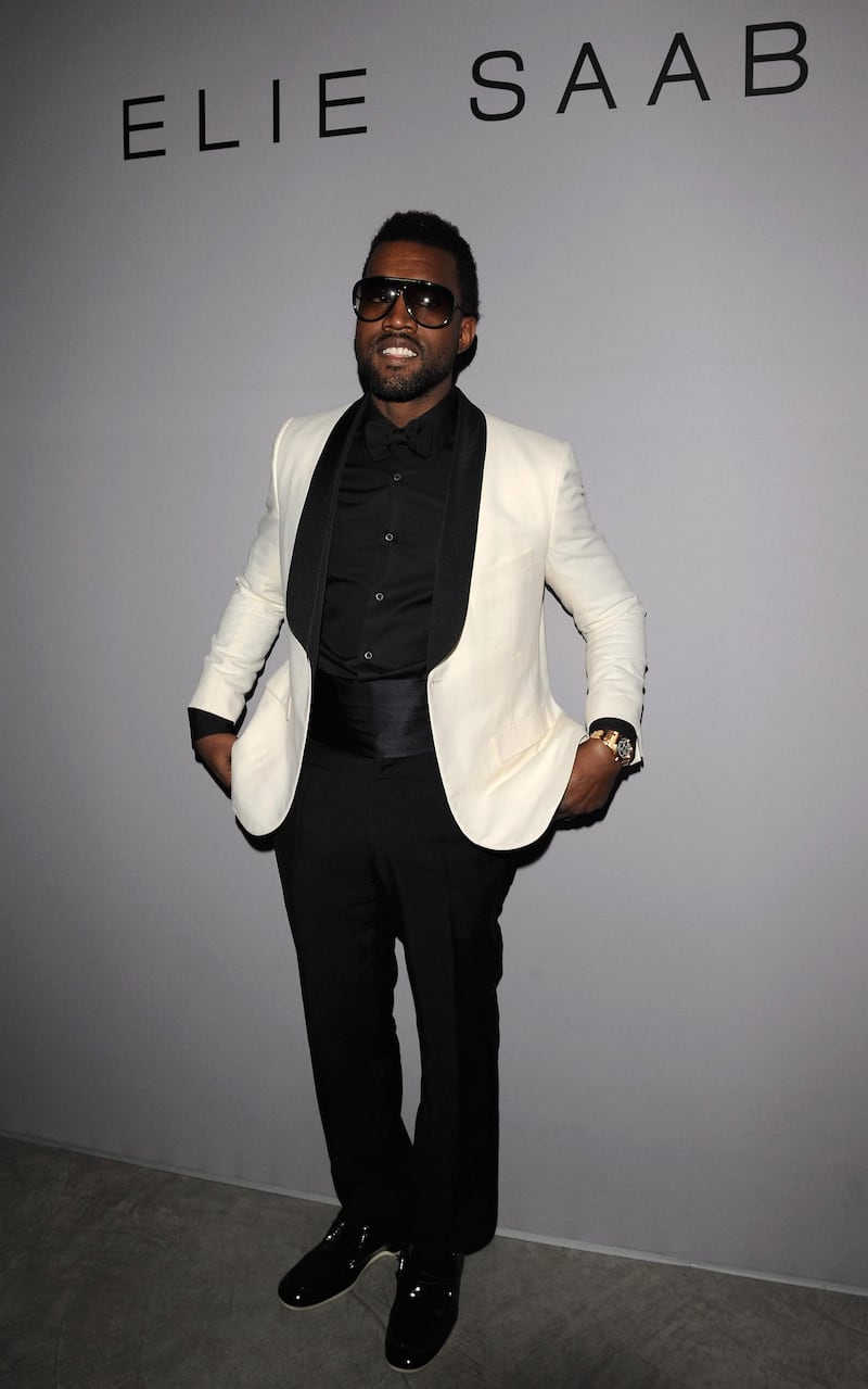PARIS - JANUARY 28:  Kanye West poses as he attends Elie Saab fashion show during Paris Fashion Week Haute Couture Spring/Summer 2009 on January 28, 2009 in Paris, France  (Photo by Pascal Le Segretain/Getty Images)