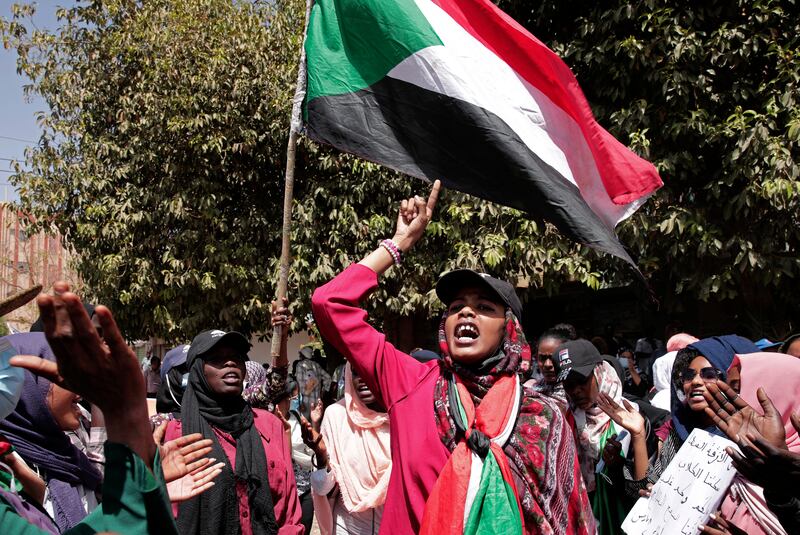 After the rally reached the presidential palace in the capital Khartoum, security forces chased protesters into nearby streets. AP