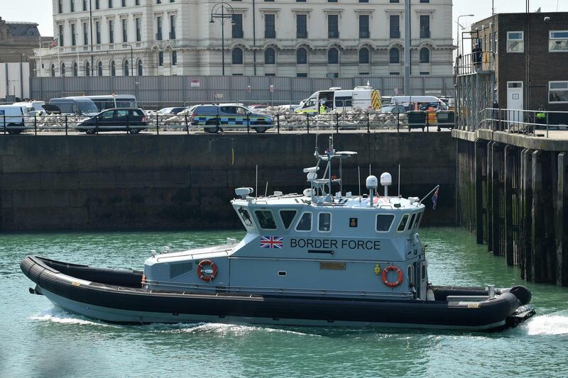 A Border Force boat goes out to meet a cutter outside the port of Dover, on the south-east coast of England on August 9, 2020. The British government on Sunday appointed a former marine to lead efforts to tackle illegal migration in the Channel ahead of talks with France on how to stop the dangerous crossings. / AFP / Glyn KIRK
