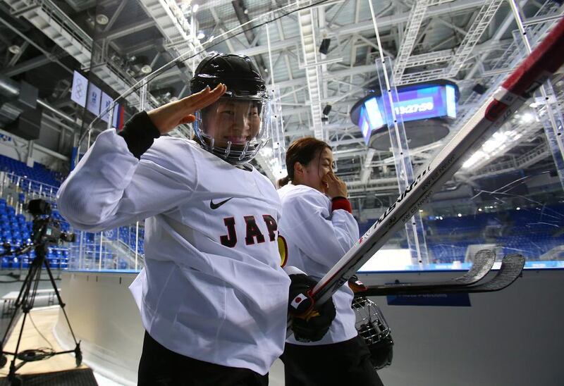 Ice hockey player Ami Nakamura of Japan gestures during practice at Shayba Arena on Sunday. Martin Rose / Getty Images