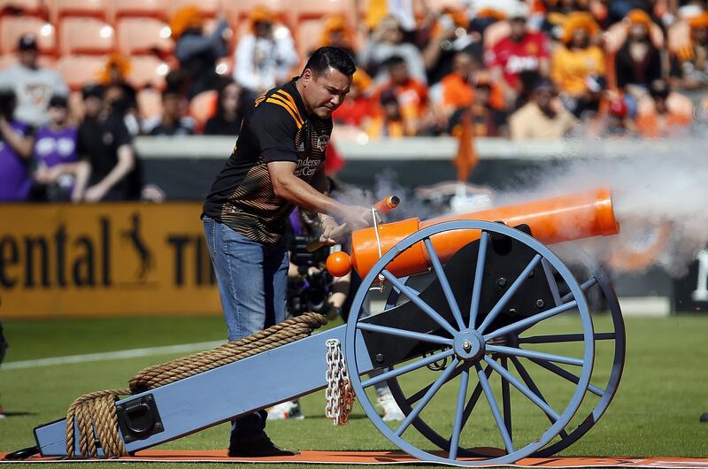 Houston Dynamo minority owner and former world boxing champion Oscar De La Hoya fires a canon to start the Major League Soccer game against the Los Angeles Galaxy at BBVA Stadium in Houston, on Saturday, February 29. Getty