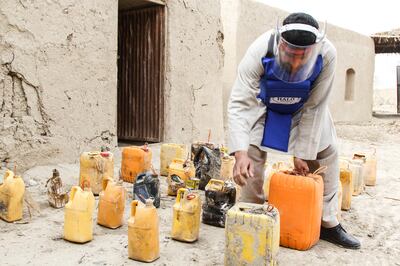 A Halo explosives expert removes a cache of IEDs from a farmer's outbuilding in Afghanistan. Photo: Halo Trust