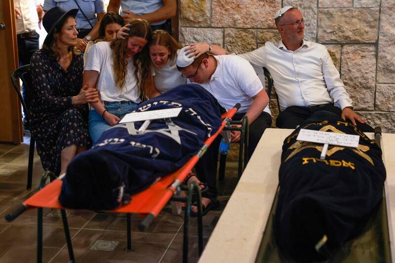 Relatives at the funeral of British-Israeli sisters Rina and Maya Dee at the Kfar Etzion settlement cemetery in the occupied West Bank. AFP