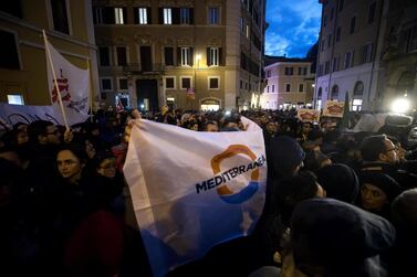 Protesters gather during a demonstration in support of German humanitarian group Sea Watch in Rome. EPA