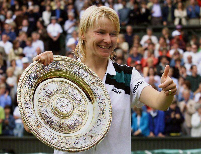epa06339937 (FILE) - Jana Novotna of the Czech Republic thumbs up as she shows her trophy after winning the ladies' single final of the Wimbledon Tennis Championships, in Wimbledon, Britain,  04 July 1998 (reissued 20 November 2017). Media reports on 20 November 2017 state that Jana Novotna died at the age of 49. Novotna, who won 16 Grand Slam titles, died of cancer and was surrounded by her family when she peacefully passed away, International Womens Tennis Association (WTA) chief Steve Simon was quoted as saying.  EPA/ANJA NIEDRINGHAUS