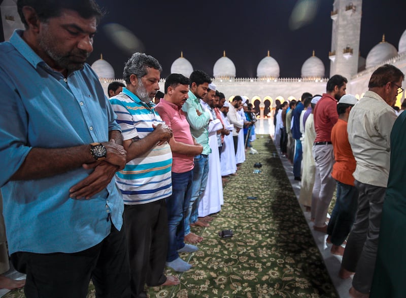 Isha prayers held at the mosque. Victor Besa / The National