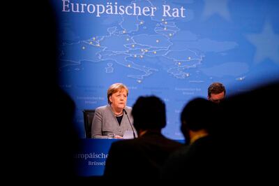 Germany's Chancellor Angela Merkel addresses the press ending the second day special European Council summit in Brussels on February 21, 2020. Time was called on the summit after two days and a night of talks that failed to narrow stubborn differences between a handful of wealthy "frugal" states and a larger group wanting more money to meet big European ambitions on top of covering a budget shortfall left by Brexit. / AFP / kenzo tribouillard
