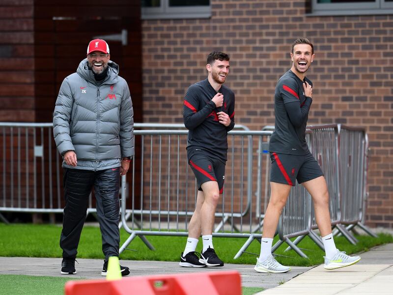 LIVERPOOL, ENGLAND - OCTOBER 02: (THE SUN OUT, THE SUN ON SUNDAY OUT) Jurgen Klopp manager of Liverpool laughing with Jordan Henderson captain of Liverpool and Andy Robertson of Liverpool during a training session at Melwood Training Ground on October 02, 2020 in Liverpool, England. (Photo by Andrew Powell/Liverpool FC via Getty Images)