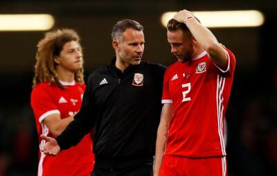 Soccer Football - International Friendly - Wales v Spain - Principality Stadium, Cardiff, Britain - October 11, 2018  Wales manager Ryan Giggs and Chris Gunter look dejected after the match   Action Images via Reuters/Andrew Couldridge