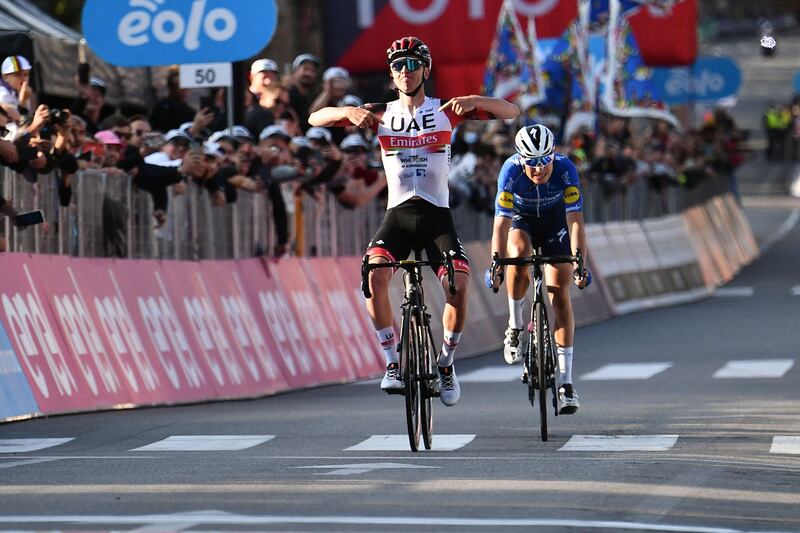 Team UAE Emirates' Tadej Pogacar celebrates as he crosses the finish line to win the Giro di Lombardia on Sunday, October 9. AFP