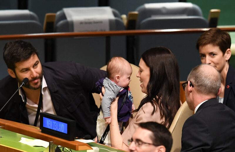 Ms Ardern holds her daughter at the Nelson Mandela Peace Summit in 2018. AFP