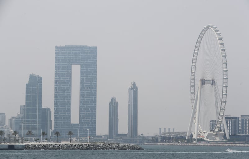 Ain Dubai in a sweltering Dubai. Weather experts say an air mass has carried moisture inland from the sea. Pawan Singh / The National 