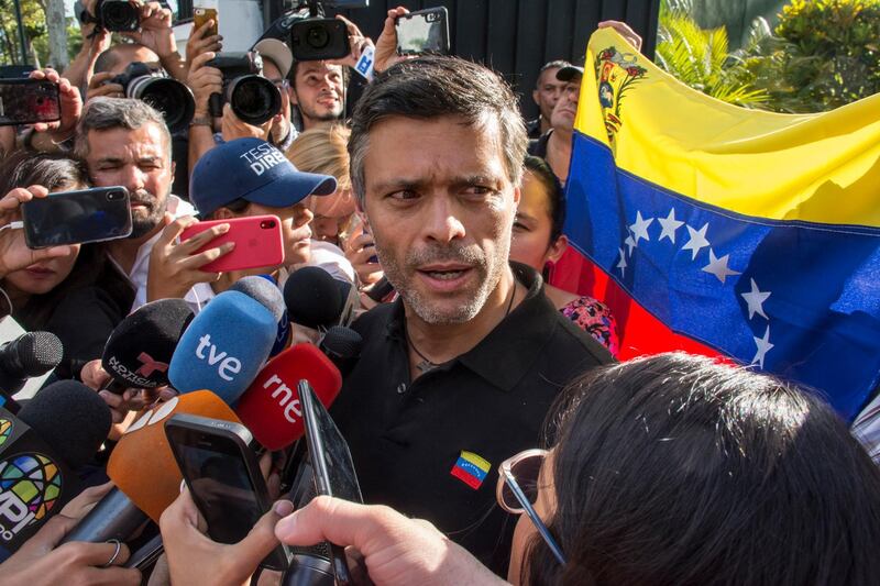 Leopoldo Lopez speaks to the media at the gate of the Spanish ambassador's residence in Caracas. Getty Images