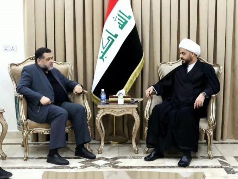 Senior Hamas leader Osama Hamdan, left, meets Qais Al Khazali, leader of Iran-backed Shiite militia Asaib Ahl Al Haq, in Baghdad. Photo: AAH