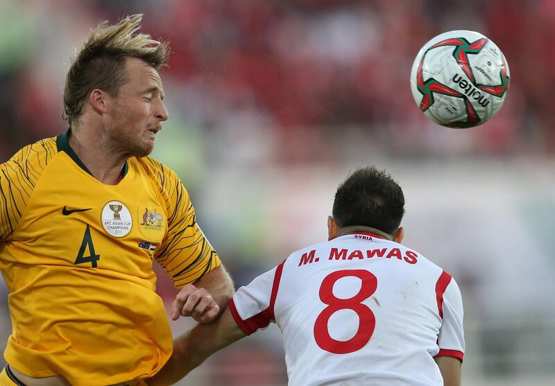 Rhyan Bert Grant, left, of Australia in action against Almawas. EPA