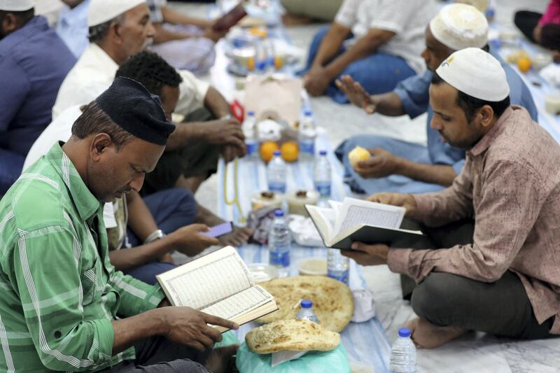 Dubai, United Arab Emirates - May 16, 2019: People read the holy quran. Mosque series for Ramdan. Lootah Masjid Mosque is an old mosque in Deira. Thursday the 16th of May 2019. Deira, Dubai. Chris Whiteoak / The National