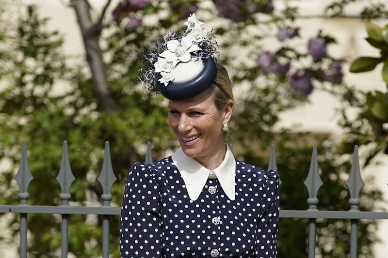 Zara Tindall, wearing a navy and white polka dot dress by LK Bennett, attends the Easter service at St George's Chapel, Windsor Castle on April 17, 2022. Getty Images