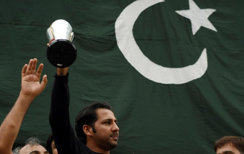 epa06038434 Sarfraz Ahmed Pakistan's Cricket Team captain holds ICC Champions trophy at his home in Karachi, Pakistan, 20 June 2017. Pakistan's Cricket Team beat India in Final of ICC champions trophy in London on 18 June.  EPA/SHAHZAIB AKBER