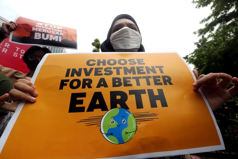 Indonesian activists rally on Earth Day outside the Ministry of Investment Co-ordinating Board office in Jakarta.  EPA