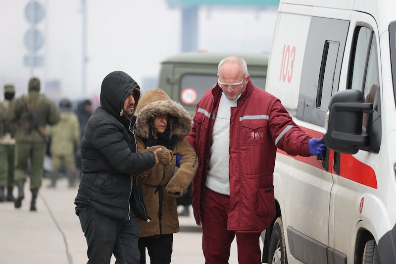A woman receives medical attention at the Bruzgi-Kuznica border crossing. AFP